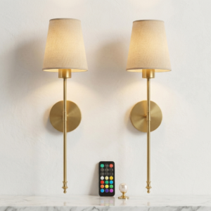 Pair of gold wall sconces mounted above marble console