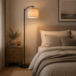 Arc floor lamp next to bed and wooden nightstand in bedroom