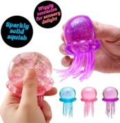 Hand squeezing pink jellyfish squishy toy showing wiggly tentacles