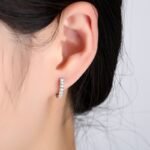 Woman wearing 925 sterling silver zircon hoop earring