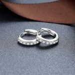 Close-up of sterling silver zircon hoop earrings pair