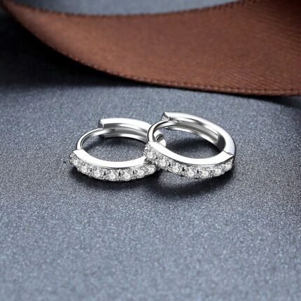 Close-up of sterling silver zircon hoop earrings pair