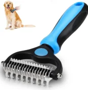 Blue double-sided dog dematting comb with golden retriever being groomed